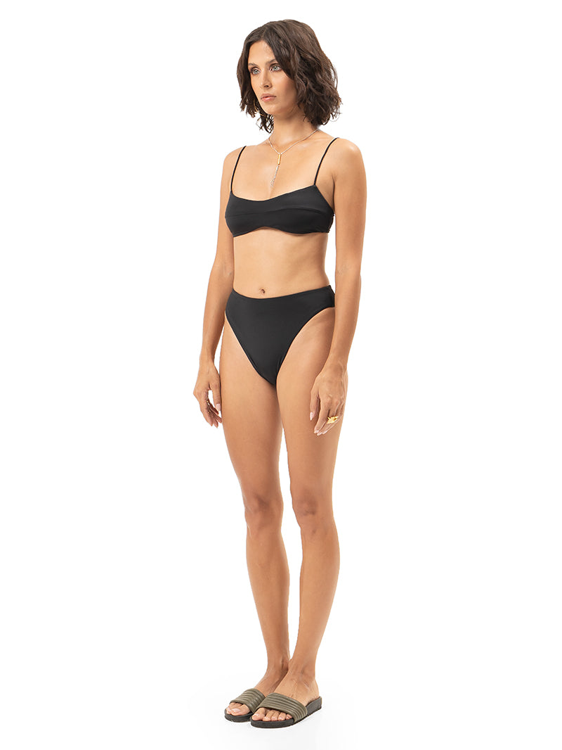 Bandeau bikini top and high-cut bikini bottoms in black. side view - worn by model