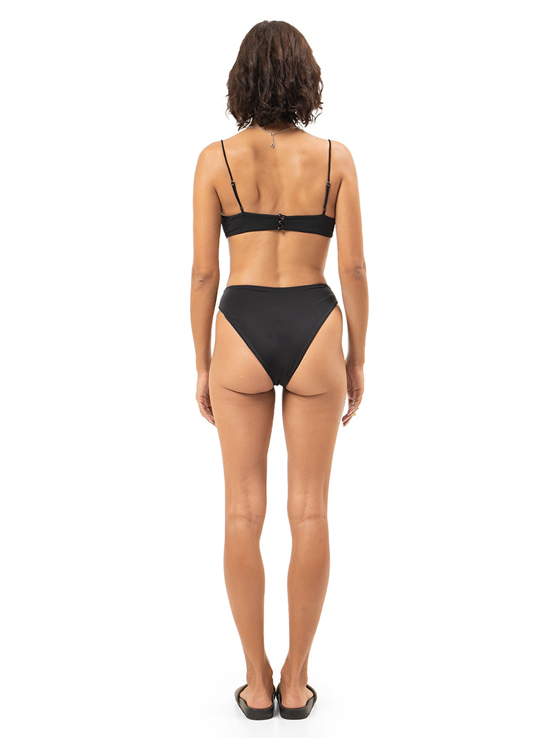 Bandeau bikini top and high-cut bikini bottoms in black. back view - worn by model