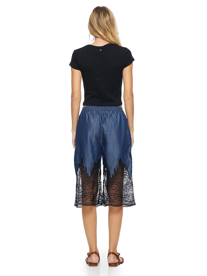 Fama crop t-shirt in black, styled with Mora pants and Margot flats, back view - worn by model