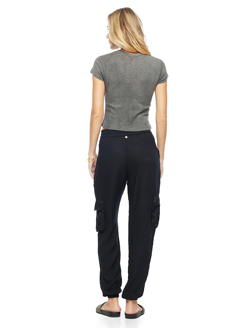 Fama crop t-shirt in grey wash styled with Cargo pants and Flaviana slides, back view - worn by model