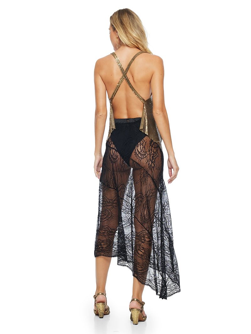 Vesta sheer black lace skirt styled with Lame top, Dega one-piece swimsuit and Margot heels, back view - worn by model