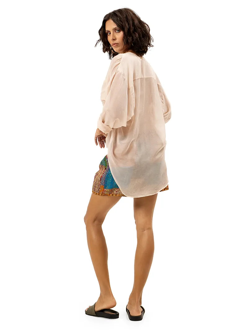Arya shorts styled with Silk shirt and Flaviana slides, back view - worn by model