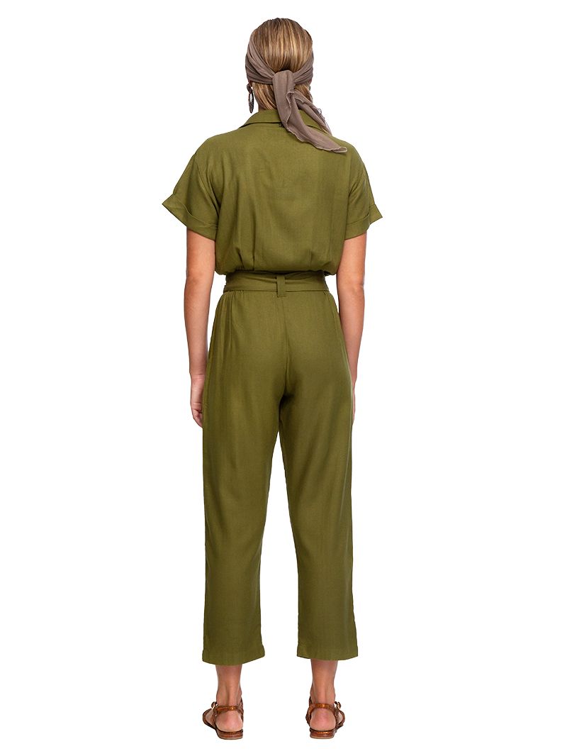 Tukang jumpsuit in matcha green, styled with Margot flats, back view - worn by model