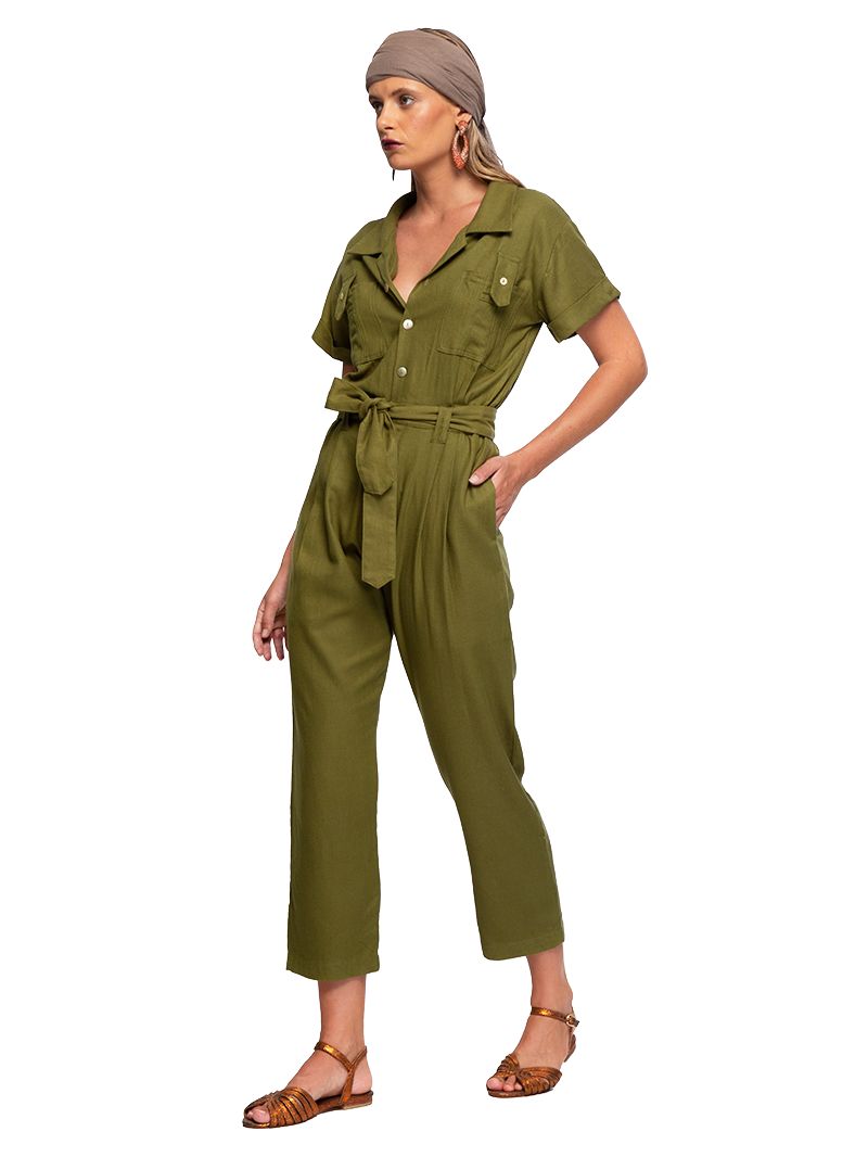 Tukang jumpsuit in matcha green, styled with Margot flats, quarter front view - worn by model