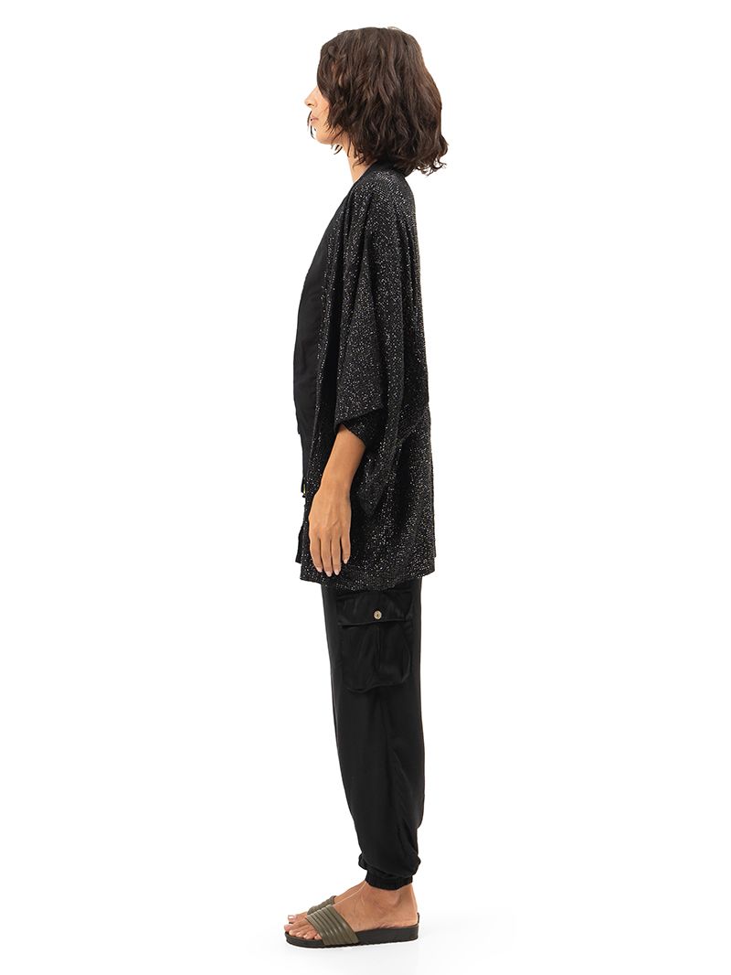 Geisha black hand-beaded outer kimono styled with Apollo snake green bikini and black Cargo pants, side view - worn by model