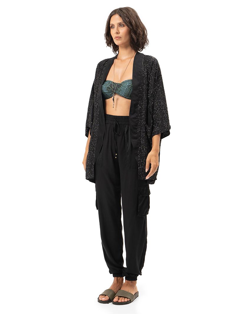 Geisha black hand-beaded outer kimono styled with Apollo snake green bikini and black Cargo pants, side view - worn by model