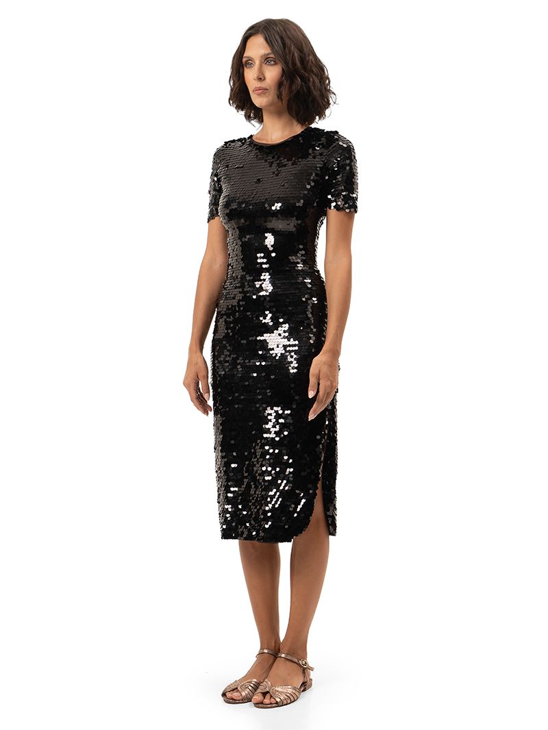 Venus black beaded midi dress styled with Margot flats, side view - worn by model
