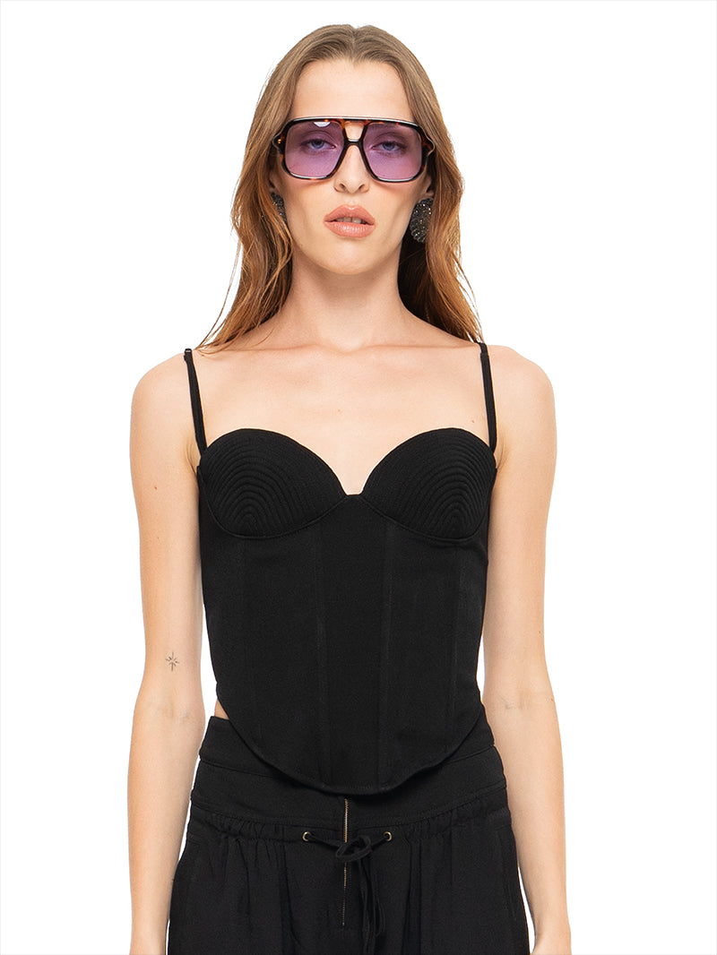 Angie bustier top in black styled with Luma pants, front view - worn by model