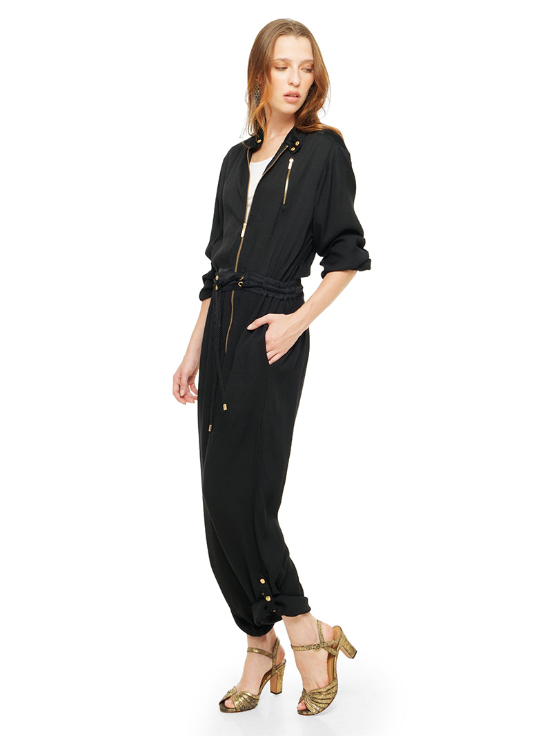 Berlin black jumpsuit styled with white t-shirt and Margot heels, quarter front view - worn by model
