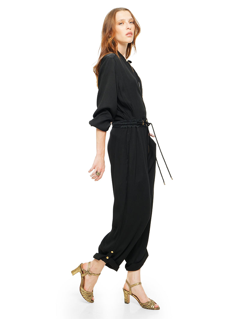 Berlin black jumpsuit styled with white t-shirt and Margot heels, side view - worn by model