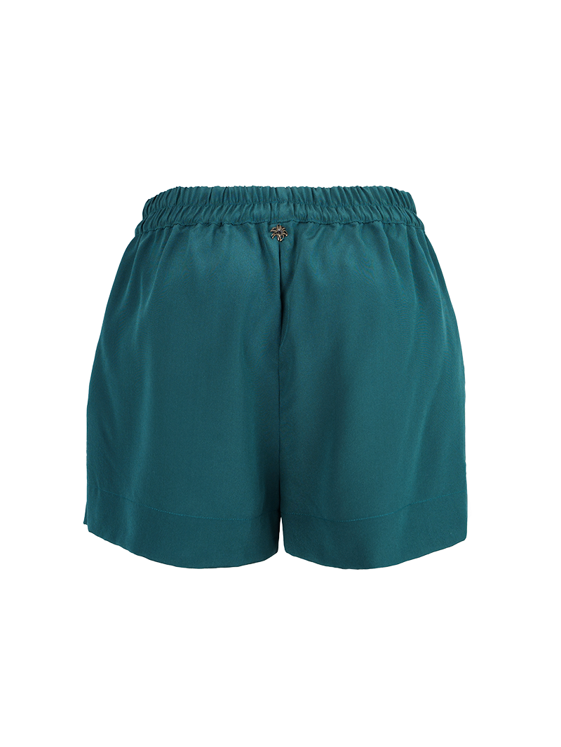 Caravan shorts in Pine Green - ghost back view