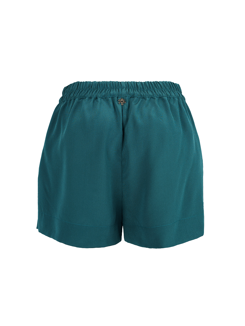 Caravan shorts in Pine Green - ghost back view