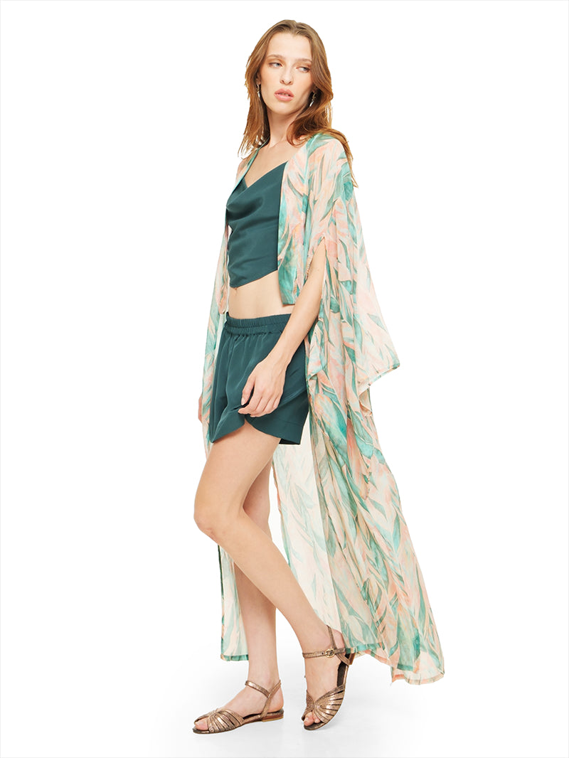 Caravan shorts in pine green styled with Maz top, Kyoto kimono and Margot flats, side view - worn by model