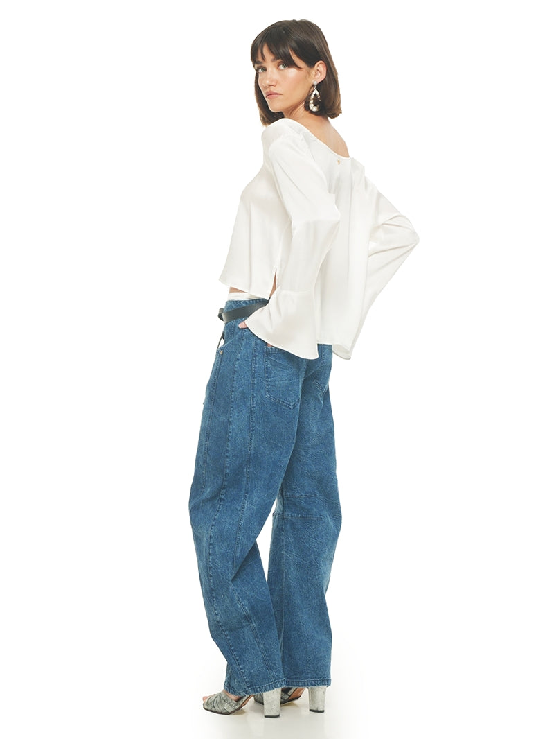 Catch jeans pants styled with Rama top and Margot heels, quarter back view - worn by model