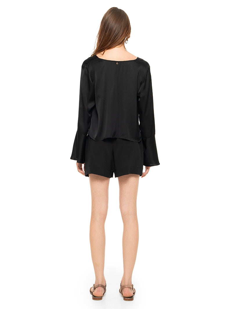 Rama top in black styled with Caravan shorts and Margot flats, back view - worn by model