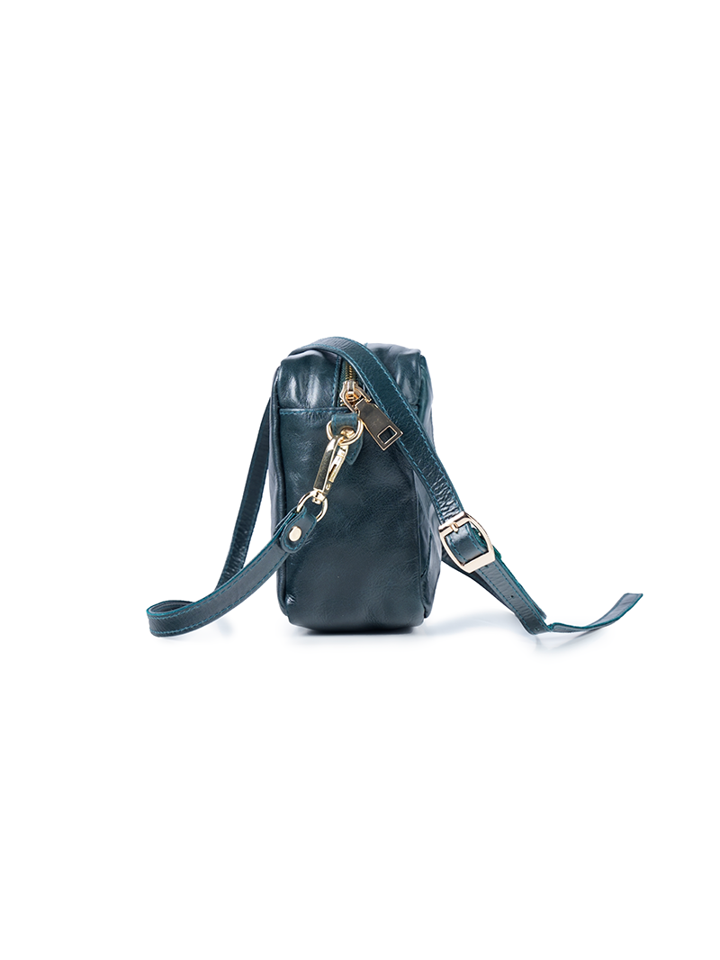 Rimba leather shoulder bag with a diamond-quilted pattern, featuring matching detachable shoulder and crossbody straps with gold-tone hardware - ghost side view.