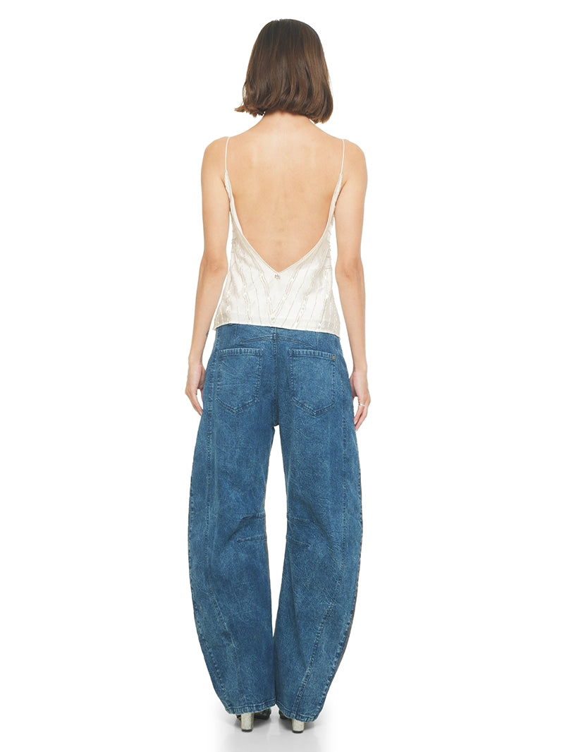 Selma beaded top in natural color styled with Catch jeans pants and Margot heels, back view - front view
