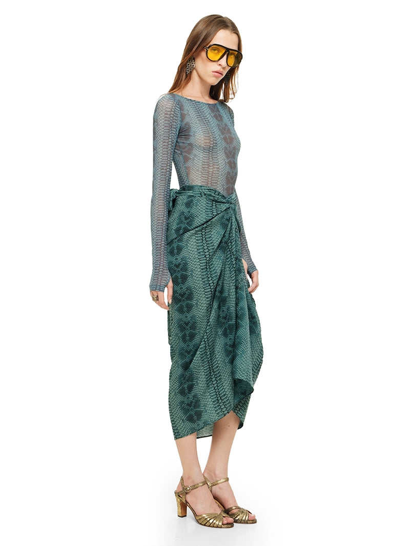 Shakti midi skirt in snake blue print styled with Boga bodysuit and Margot heels, quarter side view - worn by model