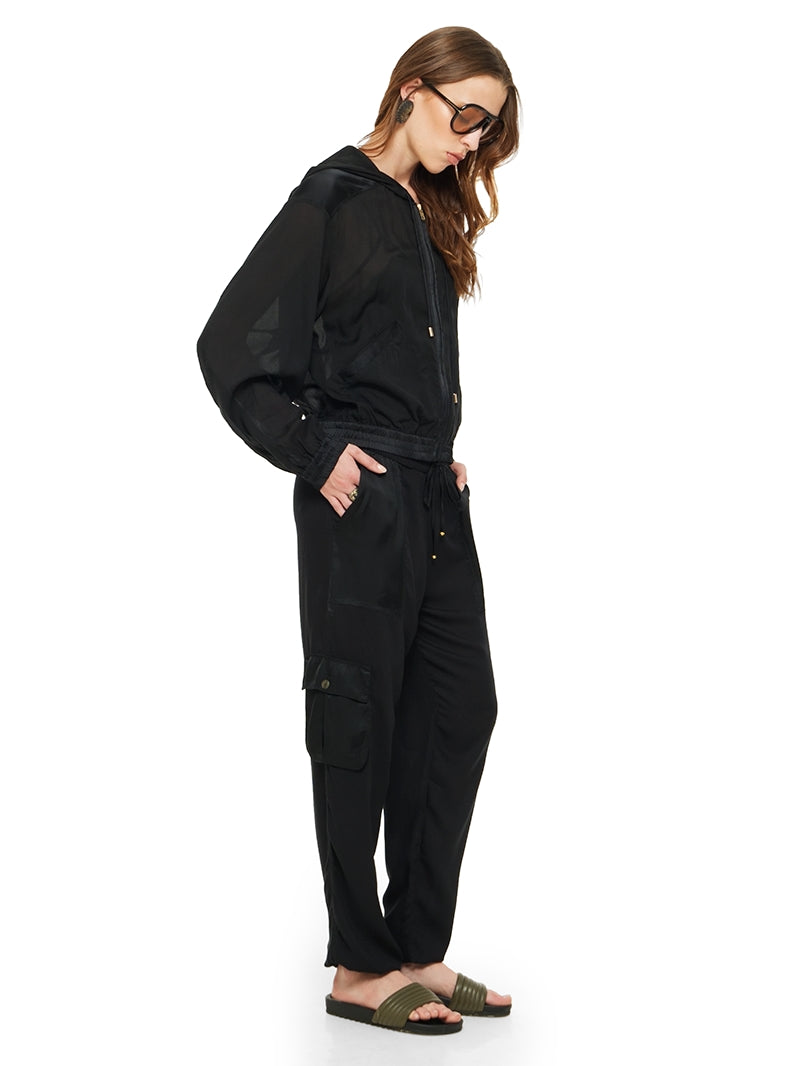 Sheer bomber jacket in black styled with Dega bodysuit, Cargo pants and Flaviana sildes, side view - worn by model