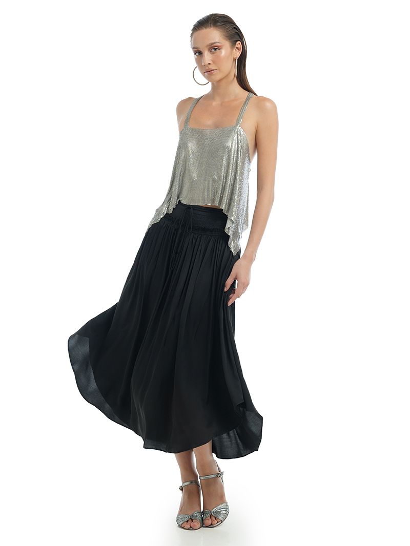 Alina black midi skirt styled with Lame silver tank top and Margot heels, side view - worn by model