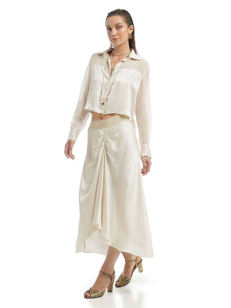 Alya midi skirt in Vanilla styled with Josie top and Margot heels, side view - worn by model