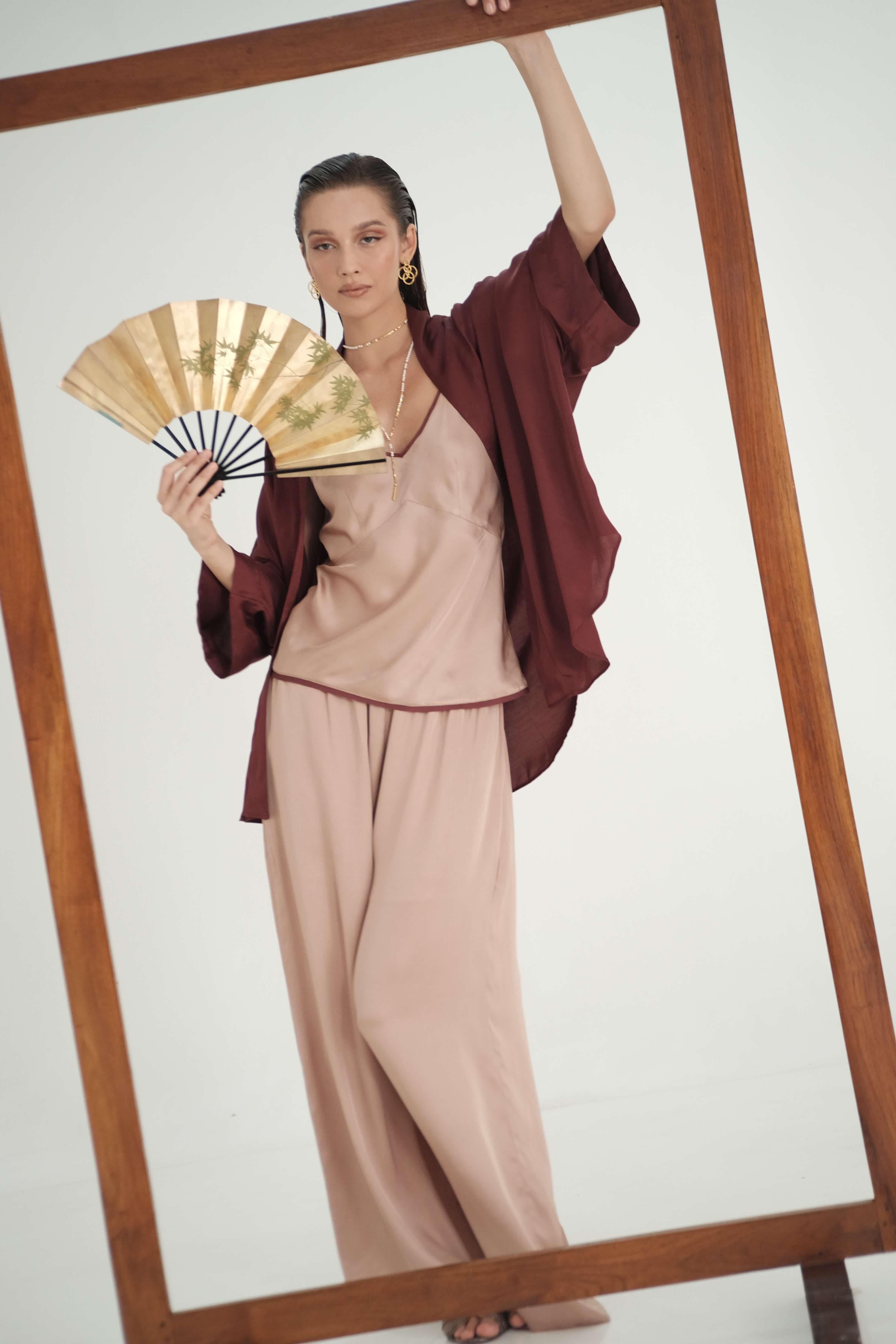 Lisa Pants in Wood Rose, styled with Isyana Kimono in wine color, and Melody Top in Wood Rose, front view - worn by model