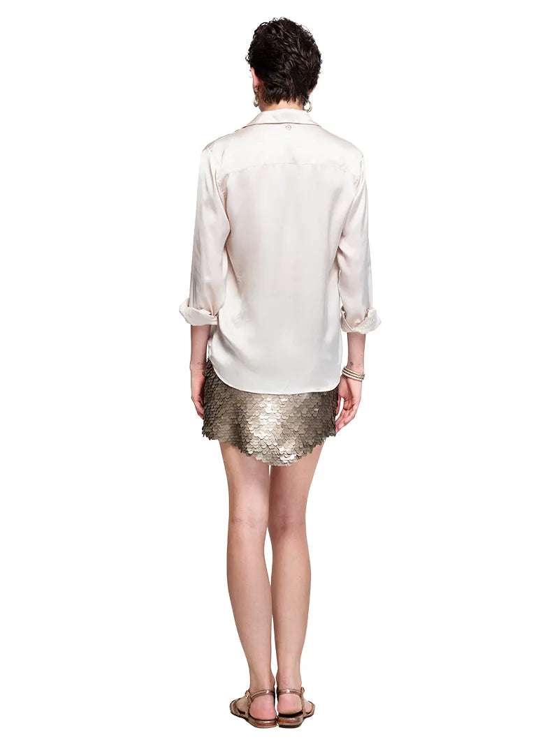 Prague sequin mini skirt styled with silk shirt and Margot flats, backview - worn by model