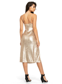 Manu dress in champagne color styled with black strap heels, back view - worn by model