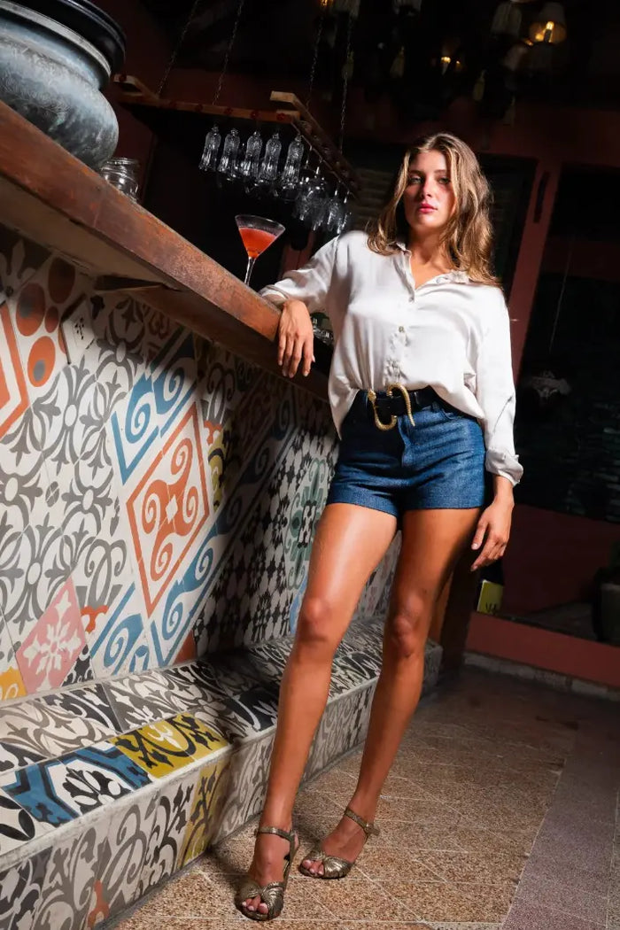Jean hot pants styled with Lucia shirt, Snake black belt, and Margot heels, front view - worn by model