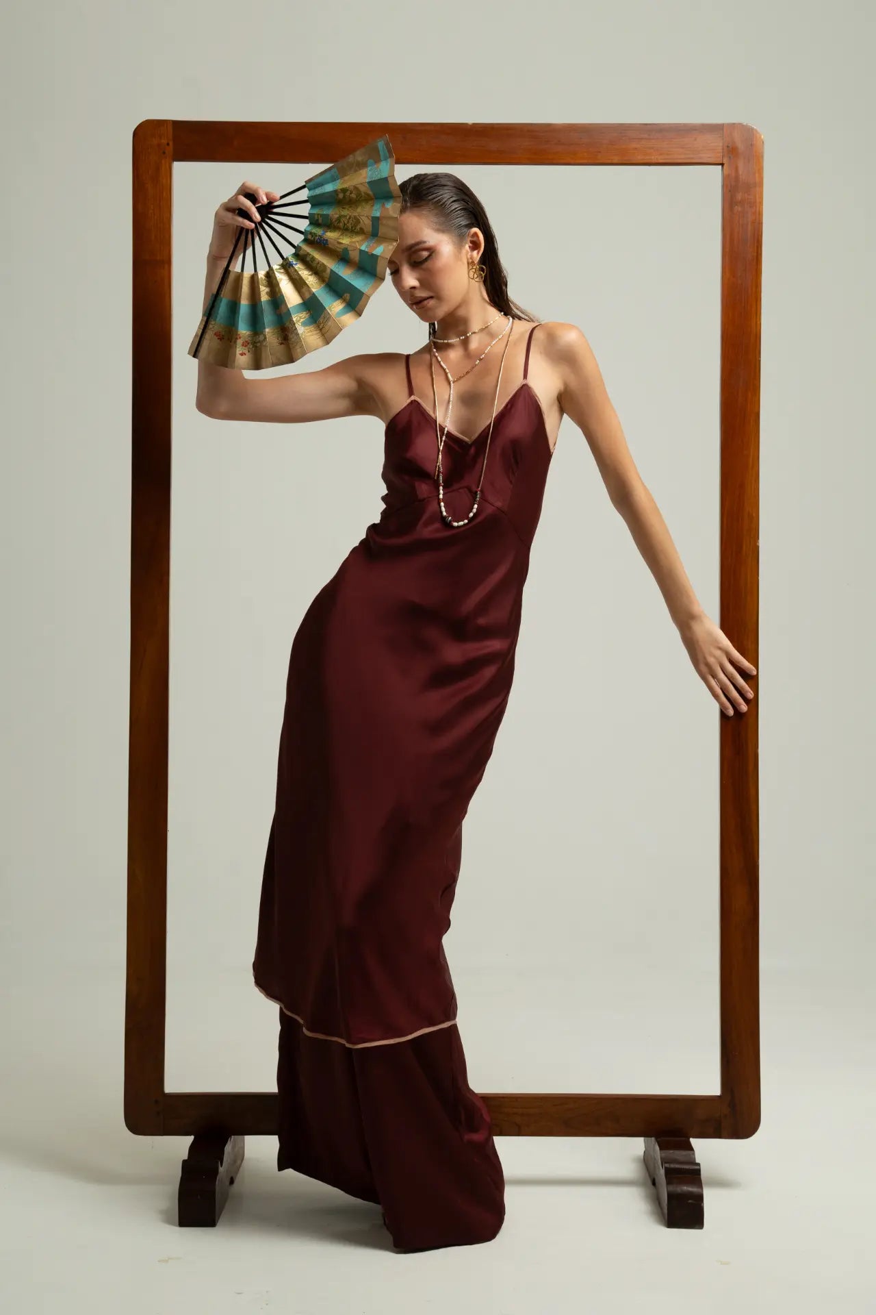 Melody Slip Dress in Wine color styled with Lisa Pants also in Wine color, front view - worn by model