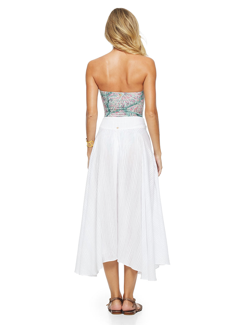 Oze midi skirt in white styled with Daisy printed bathing suit, back view - worn by model
