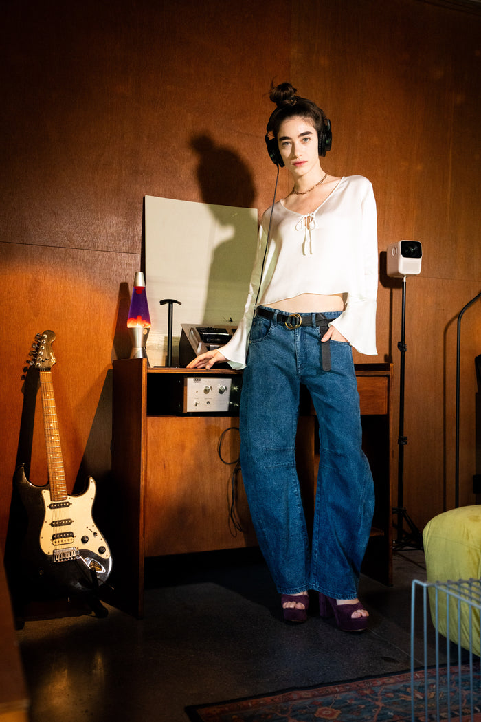 Catch Pants - Model wearing stone-washed denim barrel pants