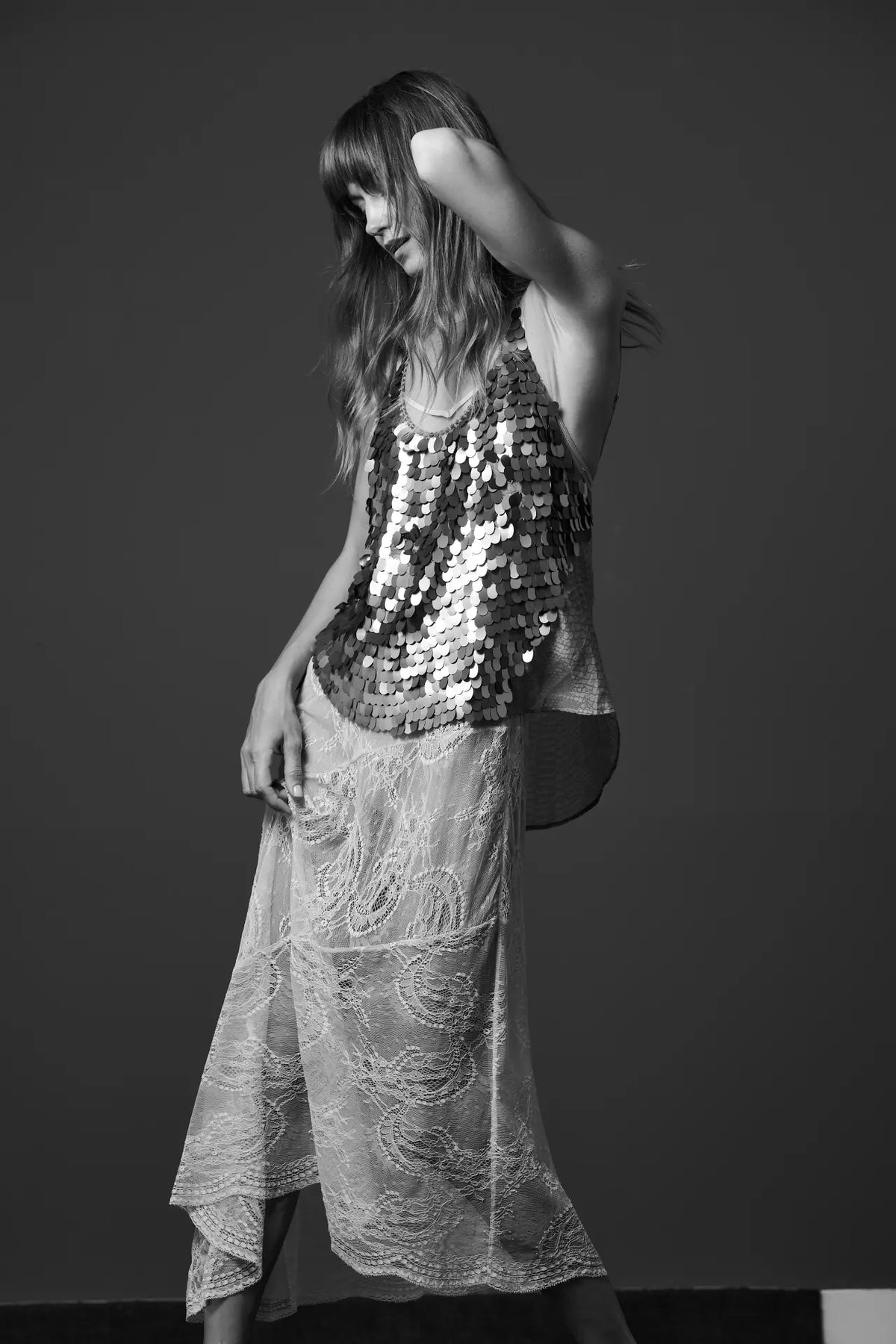 Vesta Lace skirt styled with Scale sequined top and Dega one-piece swimwear, side view - worn by model