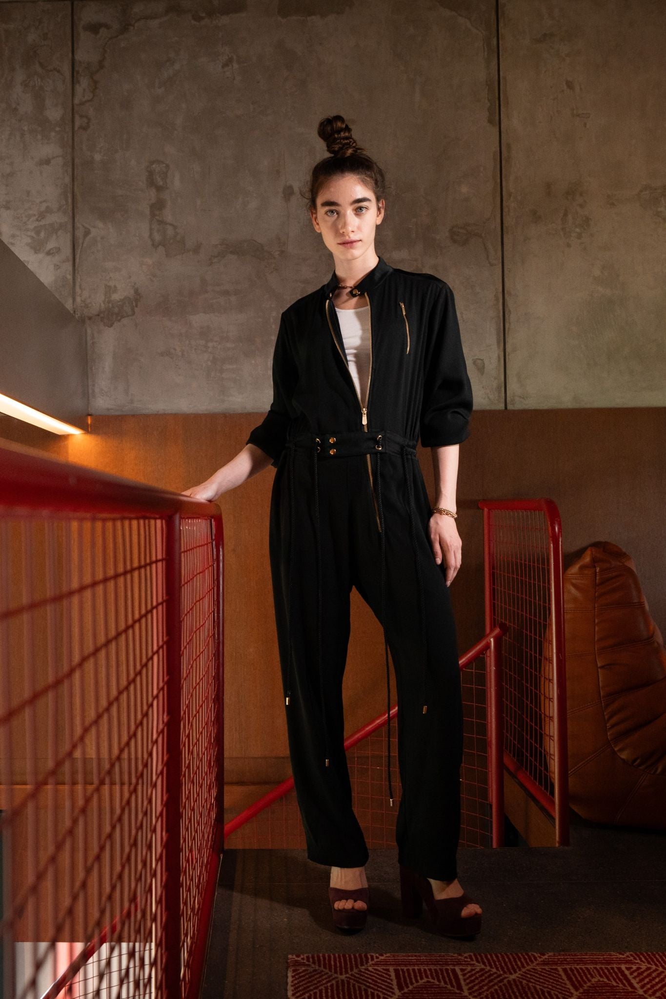 Berlin maxi jumpsuit in black styled with white tank top and Betty heels, front view - worn by model