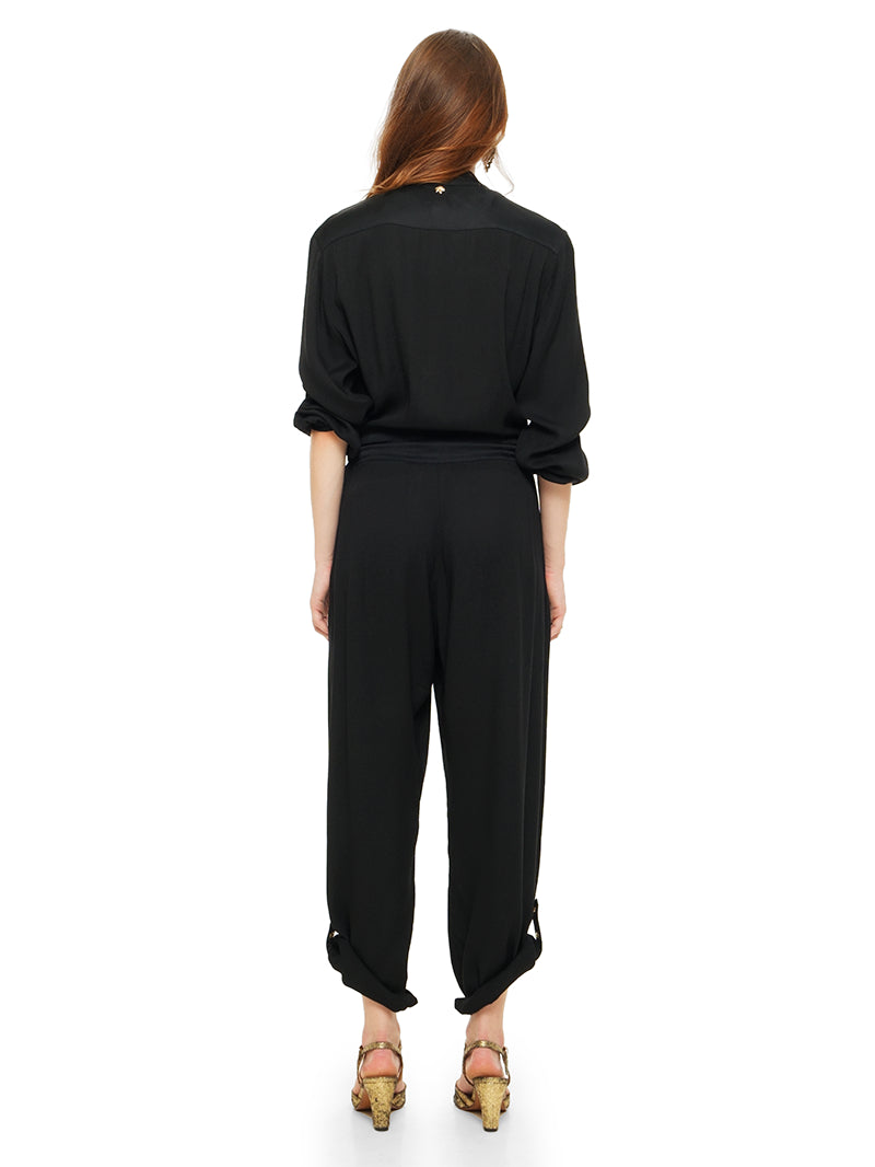 Berlin black jumpsuit styled with white t-shirt and Margot heels, quarter front view - worn by model
