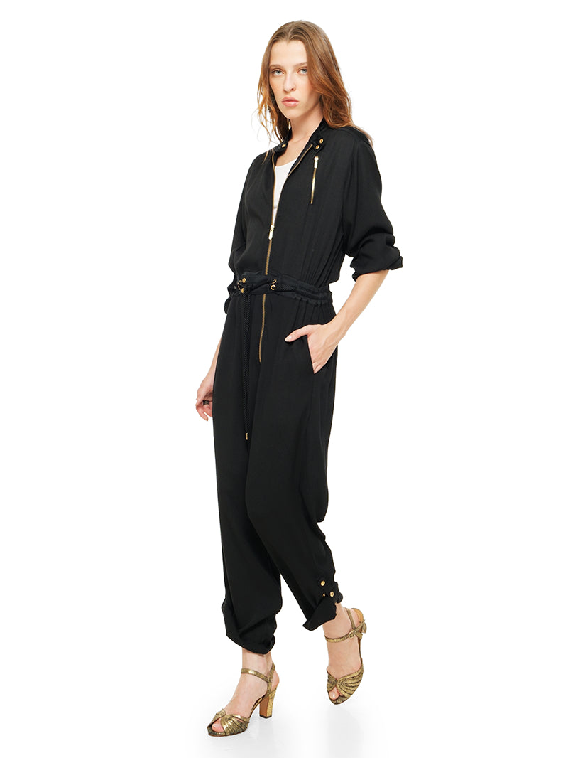 Berlin black jumpsuit styled with white t-shirt and Margot heels, quarter front view - worn by model