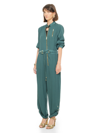 Berlin jumpsuit in pine green color styled with Margot heels, quarter front view - worn by model