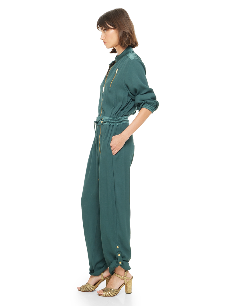 Berlin jumpsuit in pine green color styled with Margot heels, side view - worn by model