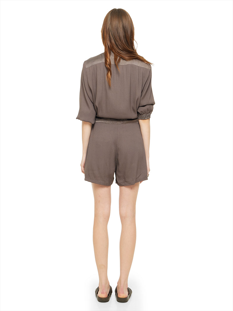 Berlin playsuit in elephant warm grey-beige styled with Flaviana slip-on sandals, back view - worn by model