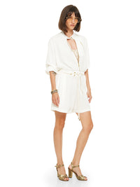 Berlin playsuit in natural color styled with Hornet beaded top and Margot heels, quarter front view - worn by model