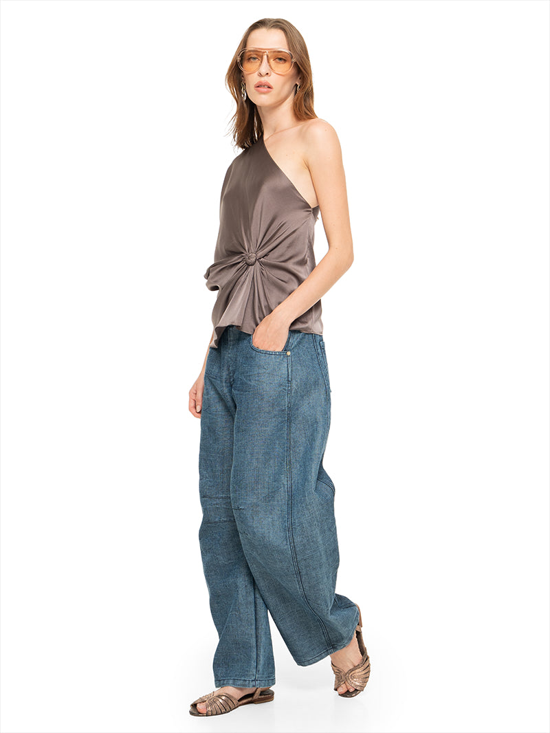 Ganesha top in elephant color, styled with Snap jeans pants, and Margot flats, quarter front view - worn by model