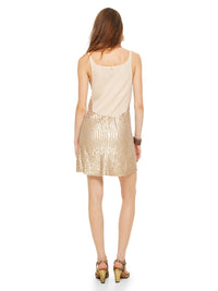 Hora beaded mini dress in blush color styled with Margot heels, back  view - worn by model