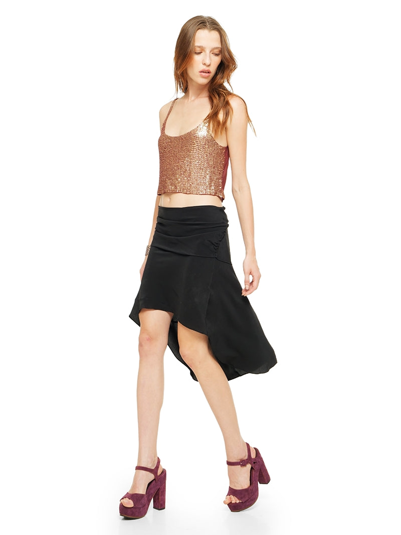 Hora beaded top in wine styled with Maz mini black dress worn as a skirt and Betty heels, quarter front view - worn by model