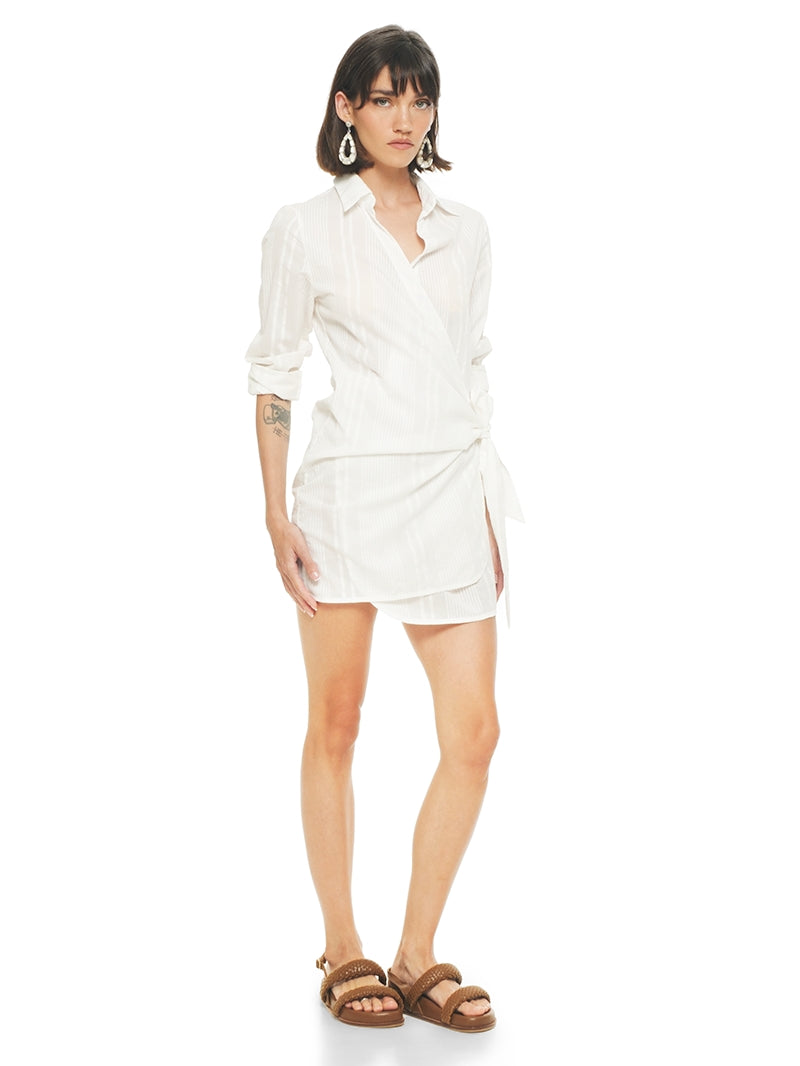 Kira mini dress in white styled with Charlie flats, quarter front view - worn by model