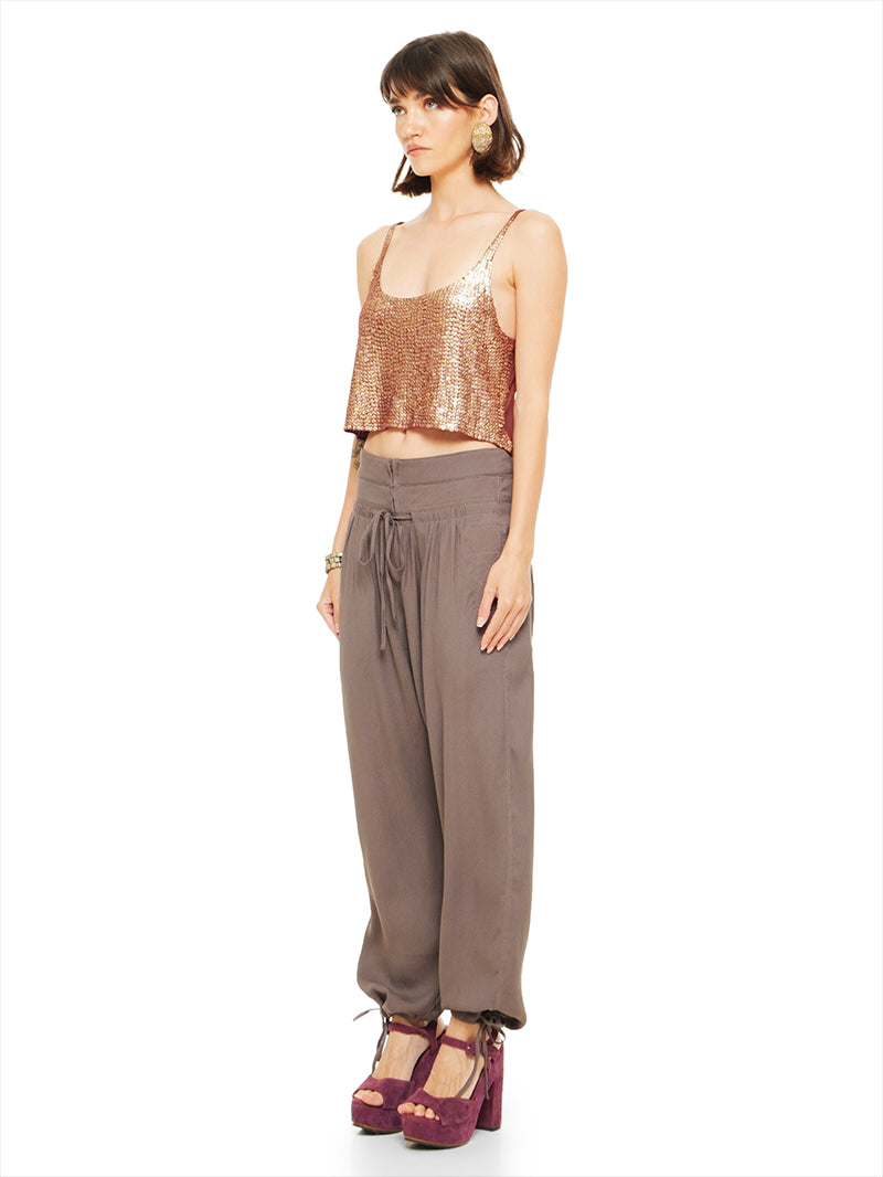 Luma pants in elephant warm grey taupe styled with Hora beaded tank top and Betty heels, quarter front view - worn by model