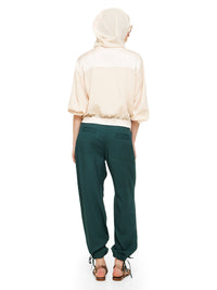 Luma pants in pine green styled with Hora beaded top, Sheer bomber jacket and Margot flats, back view - worn by model
