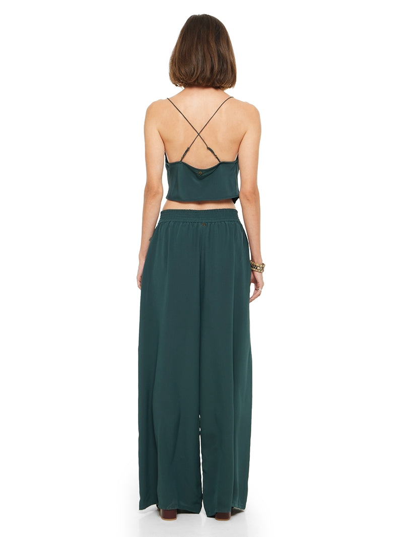Maz silk crepe top in pine green, styled with Tamia pants and Betty heels, back view - worn by model