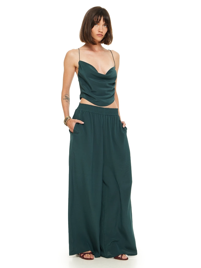 Maz silk crepe top in pine green, styled with Tamia pants and Betty heels, quarter front view - worn by model