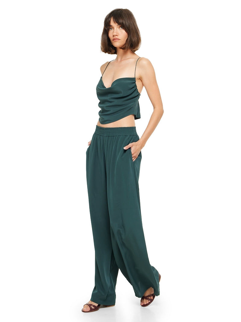 Maz silk crepe top in pine green, styled with Tamia pants and Betty heels, quarter front left view - worn by model