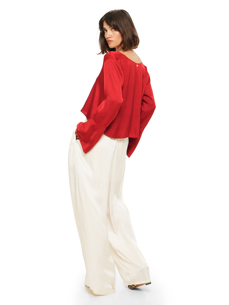Nova pants in vanilla color styled with Rama top and Margot heels, back view - worn by model